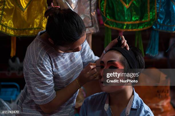 October 1, 2016. A Chinese opera troupe apply make-up before performing at Joe Sue Kung Shrine Chinese temple during the annual vegetarian festival...