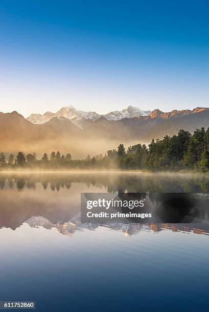 mount cook in lake matheson new zealand - lake matheson new zealand stock pictures, royalty-free photos & images