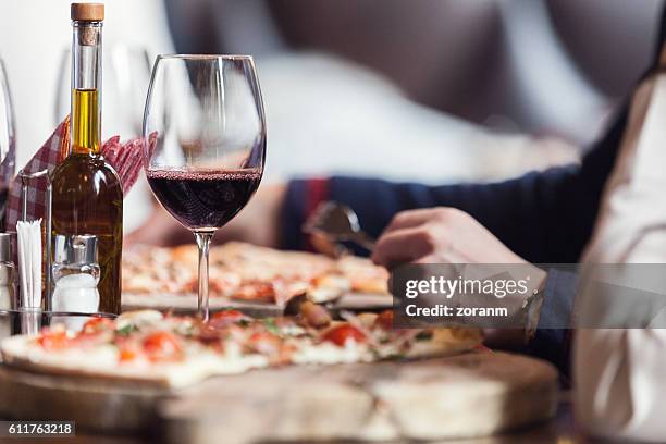 eating pizza - italian food and wine stock pictures, royalty-free photos & images