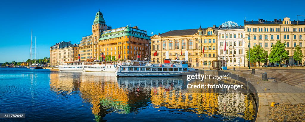 Stockholm summer sunrise on Nybroviken harbour hotels ferries panorama Sweden