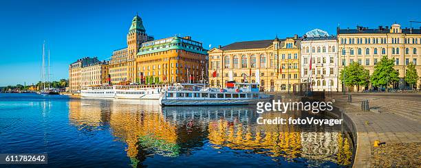 stockholm summer sunrise on nybroviken harbour hotels ferries panorama sweden - stockholm stock pictures, royalty-free photos & images