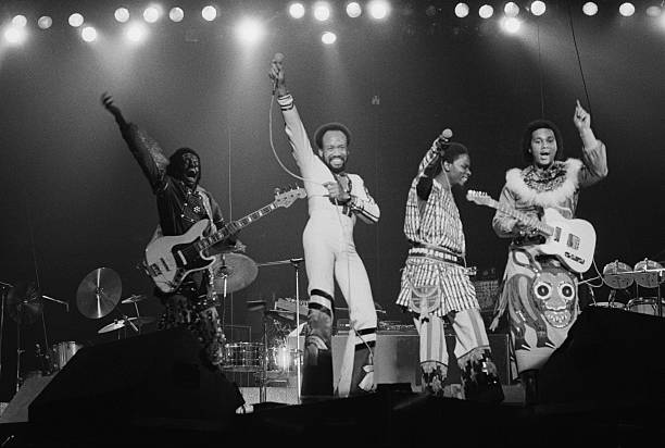 American soul, funk and disco group Earth, Wind & Fire performing on stage, USA, 3rd February 1978. Left to right: Verdine White, Maurice White,...