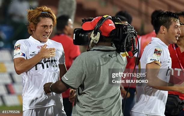 Northeast United FC's midfielder Katsumi Yusa celebrates after scoring a goal during the Indian Super League football match between Northeast United...