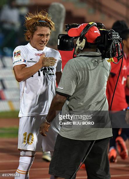 Northeast United FC's midfielder Katsumi Yusa celebrates after scoring a goal during the Indian Super League football match between Northeast United...