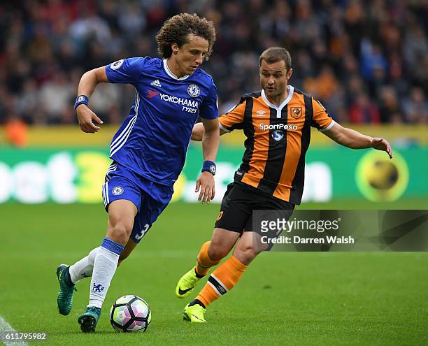 David Luiz of Chelsea is put under pressure from Shaun Maloney of Hull City during the Premier League match between Hull City and Chelsea at KCOM...