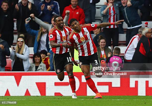 Patrick van Aanholt of Sunderland celebrates scoring his sides first goal with team mate Jermain Defoe of Sunderland during the Premier League match...