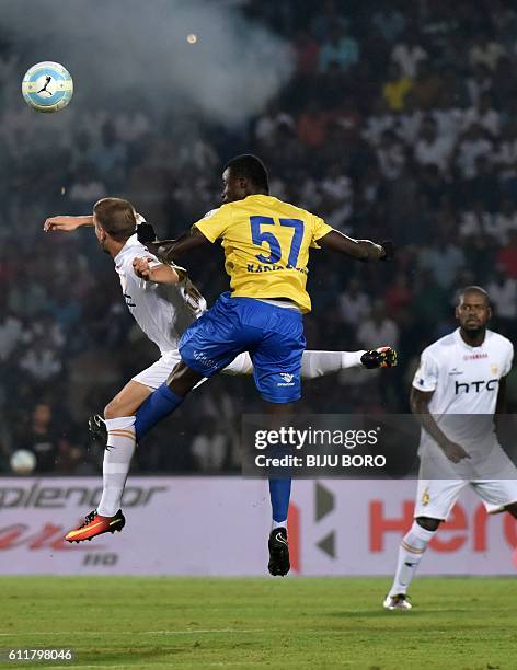 Kerala Blasters FC's midfielder Didier Boris Kadio and Northeast United FC's forward Emiliano Alfaro fight for the ball during the Indian Super...