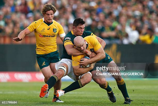 South African flank Francois Louw tackles Australian hooker and Captain Stephen Moore during the Castle Lager Rugby Championship international test...