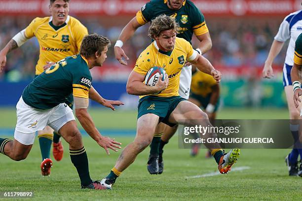 Australian flank Michael Hooper breaks through during the Castle Lager Rugby Championship international test match between South Africa and Australia...