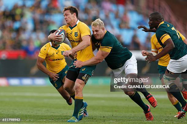 South African prop Vincent Koch tackles Australian wing Dane Haylett-Petty during the Castle Lager Rugby Championship international test match...