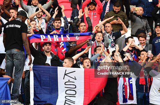 Paris Saint-Germain's ultras cheer at the end of the French L1 football match between Paris Saint-Germain and Bordeaux at the Parc des Princes...