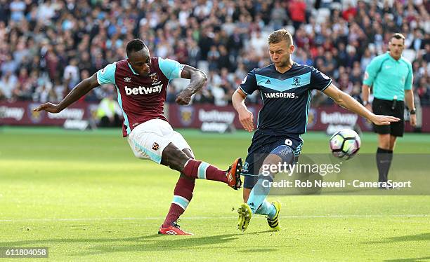 West Ham United's Michail Antonio gets in a shot under pressure from Middlesbrough's Ben Gibson during the Premier League match between West Ham...