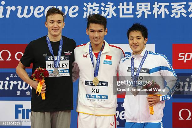 Gold medalist Xu Jiayu of China,Silver medalist Bobby Hurley of Australia and bronze medalist Daiya Seto of Japan poses during the medal ceremony for...