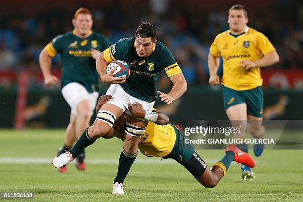 South Africa's flank Francois Louw vies with Australia's players during the Castle Lager Rugby Championship International test match between South...