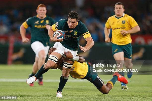 South Africa's flank Francois Louw vies with Australia's players during the Castle Lager Rugby Championship International test match between South...