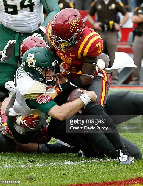 Quarterback Seth Russell of the Baylor Bears scores a touchdown as defensive back Mike Johnson of the Iowa State Cyclones blocks in the first half of...