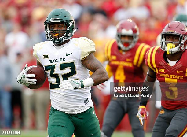 Running back Shock Linwood of the Baylor Bears drives the ball into the end zone for a touchdown pas defensive back Evrett Edwards, and defensive...