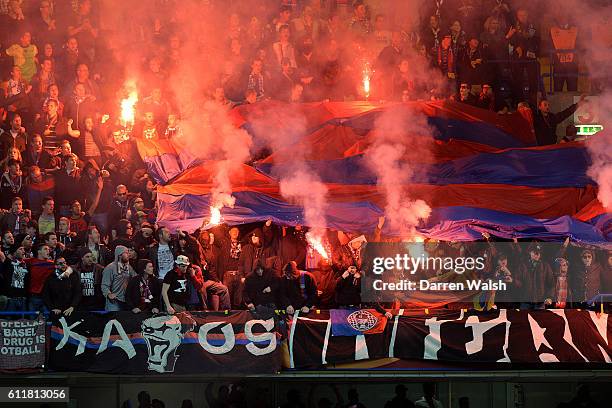 Basel fans let off flares in the stands