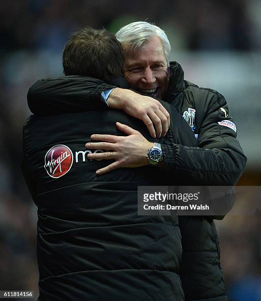 Newcastle United manager Alan Pardew celebrates his side's third goal of the game by hugging Assistant Manager John Carver