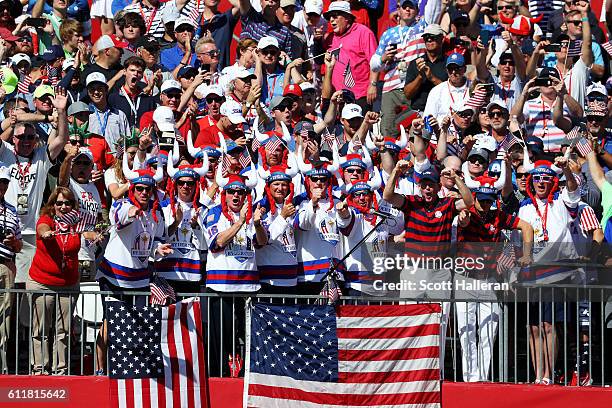 Brandt Snedeker and Zach Johnson of the United States celebrate with fans in the crowd during afternoon fourball matches of the 2016 Ryder Cup at...