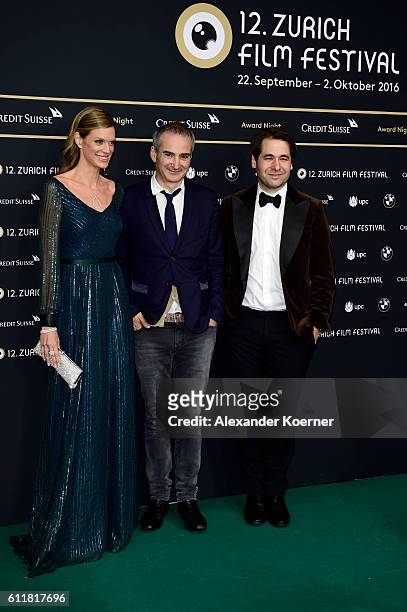 Festival director Nadja Schildknecht, Olivier Assayas and Festival director Karl Spoerri attend the Award Night during the 12th Zurich Film Festival...