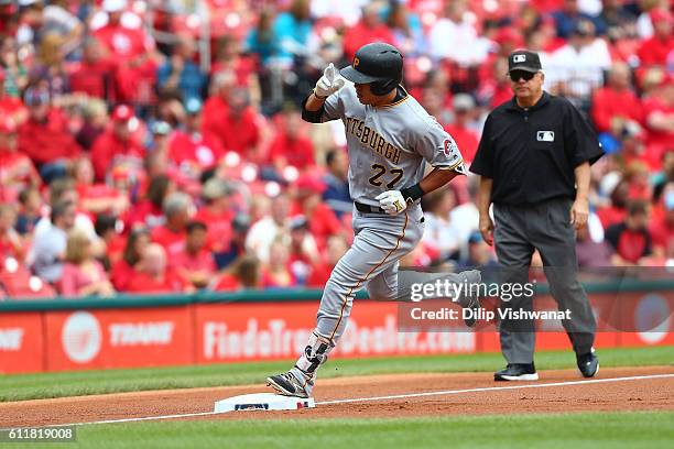 Jung Ho Kang of the Pittsburgh Pirates rounds third base after hitting a three-run home against the St. Louis Cardinals in the first inning at Busch...