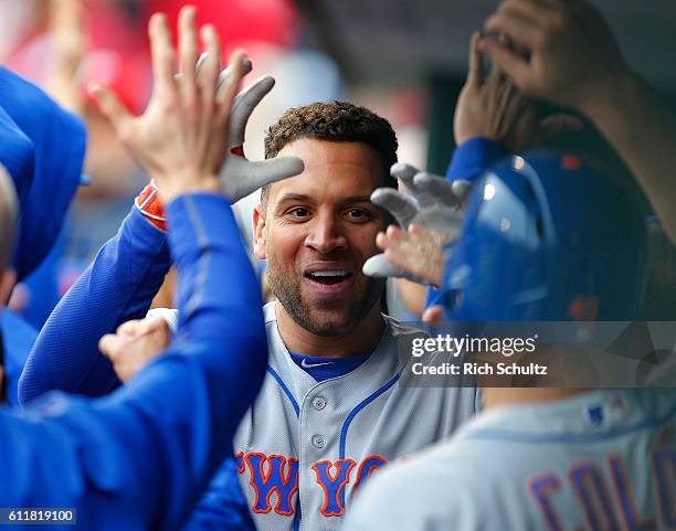 James Loney of the New York Mets is congratulated after hitting a two-run home run against the Philadelphia Phillies during the sixth inning of a...