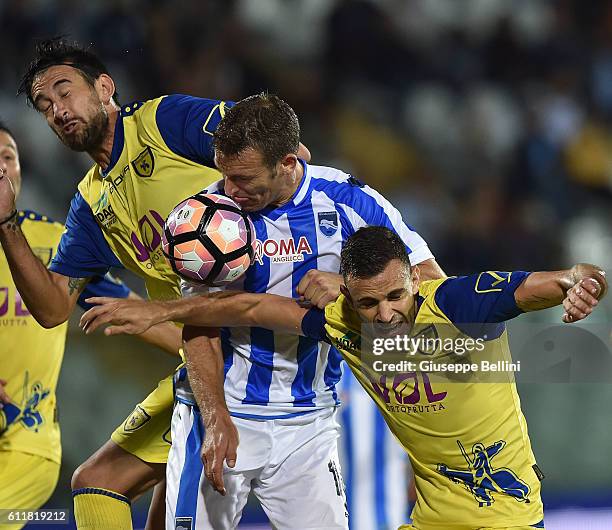 Nicolas Spolli of AC Chievo Verona and Hugo Campagnaro of Pescara Calcio and Ivan Radovanovic of AC Chievo Verona in action during the Serie A match...