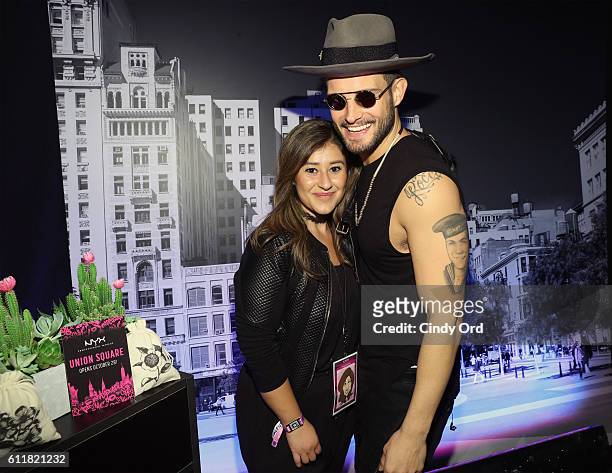 Professional Makeup Head of Events Miriam Janette Rodriguez and actor Nico Tortorella pose in the NYX Professional Makeup area at BeautyCon NYC 2016...