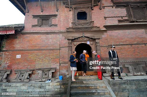 Nepalese Priests offering ritual puja during the Gatasthapana first day of Biggest Hindu festival Dashain at Nasal Chowk, Basantapur Durbar Square.