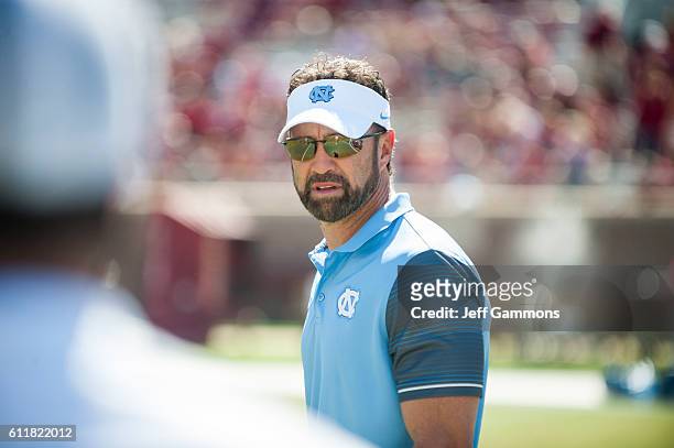 Head coach of the North Carolina Tar Heels Larry Fedora watches his team before the game against the Florida State Seminoles at Doak Campbell Stadium...