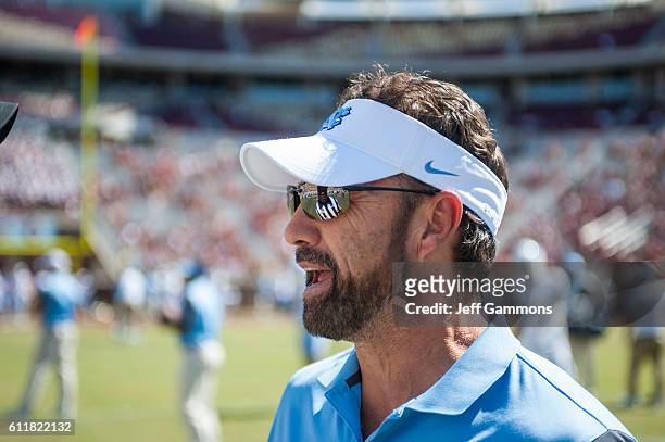 Head coach of the North Carolina Tar Heels Larry Fedora watches his team before the game against the Florida State Seminoles at Doak Campbell Stadium...
