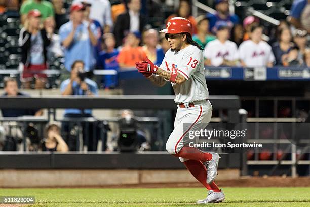 Philadelphia Phillies Shortstop Freddy Galvis [8264] scores on a single by A.J. Ellis in the 11th inning of a regular season game between the...