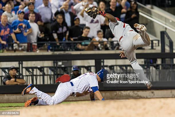 Philadelphia Phillies Third base Maikel Franco [9867] dives over New York Mets Shortstop Asdrubal Cabrera [6195] after Cabrera stumbles going back to...