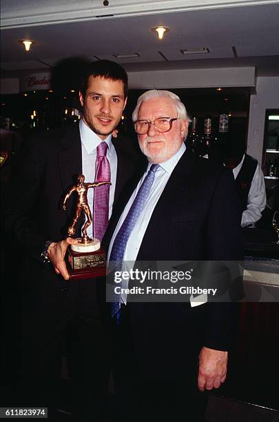 Chelsea player Carlo Cudicini accepts an award from Club Chairman Ken Bates.