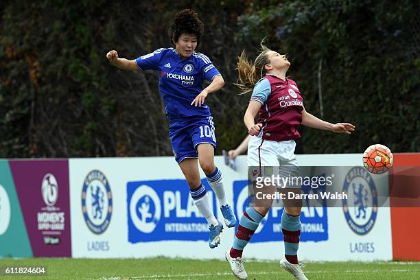 Chelsea Ladies Ji So-Yun and Aston Villa Ladies Hayley Crackle during a Women's FA Cup 6th Round match between Chelsea Ladies and Aston Villa Ladies...