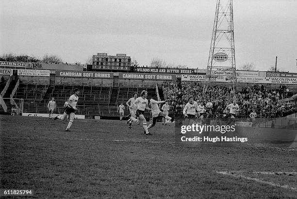 Chelsea's Paul Canoville leads an attack on the Bolton goal.