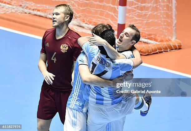 Alan Brandi of Argentina celebrates with teammates after scoring the fouth goal of his team during the final match between Russia and Argentina as...