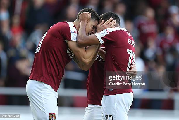 Alex Revell of Northampton Town celebrates with team mate Kenji Gorre after scoring his and his sides second goal during the Sky Bet League One match...