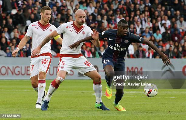 Blaise Matuidi of Paris Saint-Germain in action with Nicolas Pallois and Gregory Sertic of Girondins de Bordeaux during the French Ligue 1 match...