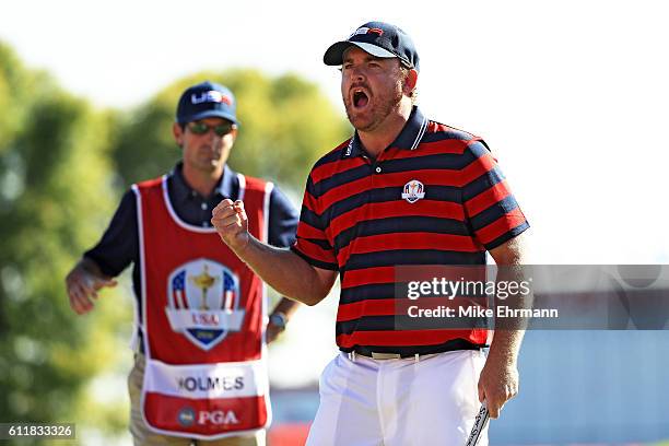 Holmes of the United States reacts to a birdie putt on the ninth green during afternoon fourball matches of the 2016 Ryder Cup at Hazeltine National...