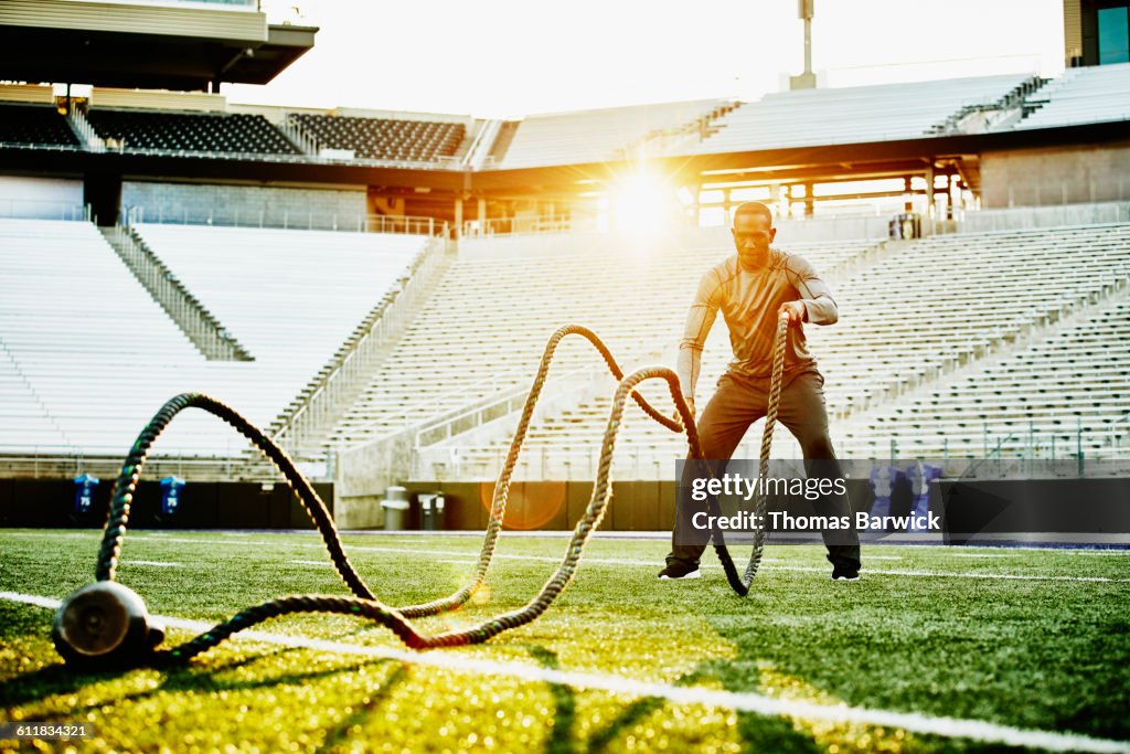 Athlete Training With Battle Rope During Workout High-Res Stock Photo ...