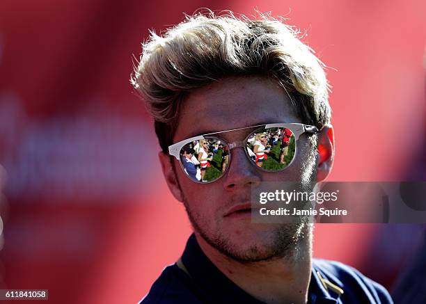 Singer Niall Horan of One Direction looks on from the 12th hole during afternoon fourball matches of the 2016 Ryder Cup at Hazeltine National Golf...