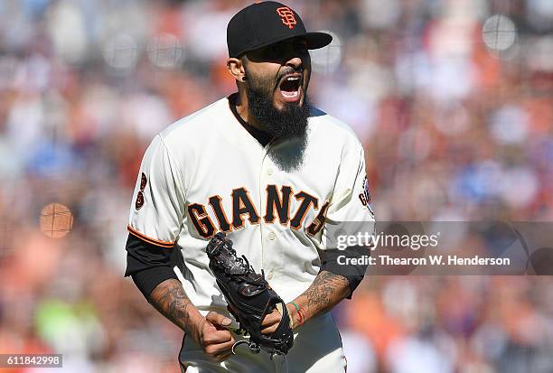 Sergio Romo of the San Francisco Giants reacts after striking out Corey Seager of the Los Angeles Dodgers for the final out of the game at AT&T Park...