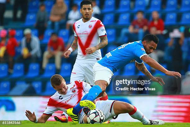 Aldo Ramirez of Cruz Azul struggles for the ball with Julio Furch of Veracruz during the 12th round match between Cruz Azul and Veracruz as part of...