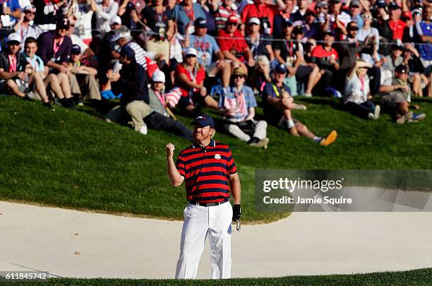 Holmes of the United States reacts after a chip on the 16th hole during afternoon fourball matches of the 2016 Ryder Cup at Hazeltine National Golf...