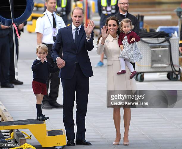Catherine, Duchess of Cambridge, Prince William, Duke of Cambridge, Prince George and Princess Charlotte wave to wellwishers as they depart Victoria...