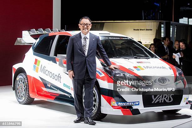 President and CEO of Toyota Motor Corporation Akio Toyoda presents their latest Toyota Yaris car during the press preview of the Paris Motor Show at...