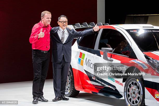 The Finnish rally driver Tommi Makinen poses next to President and CEO of Toyota Motor Corporation Akio Toyoda who presents their latest Toyota Yaris...