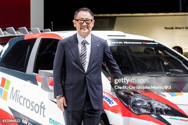 President and CEO of Toyota Motor Corporation Akio Toyoda presents their latest Toyota Yaris car during the press preview of the Paris Motor Show at...